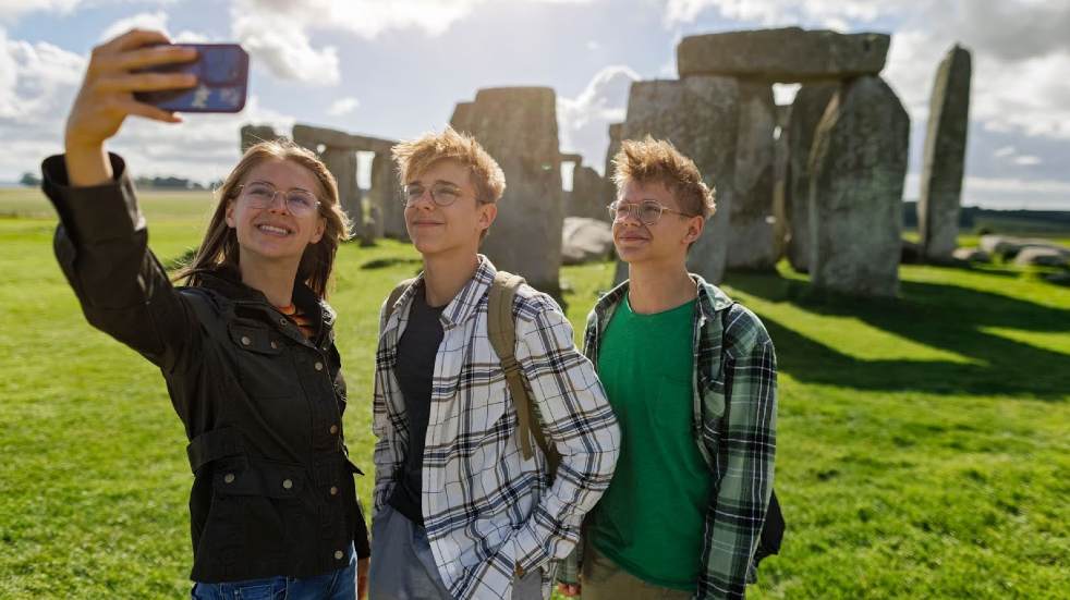 Teenagers taking selfie at Stonehenge